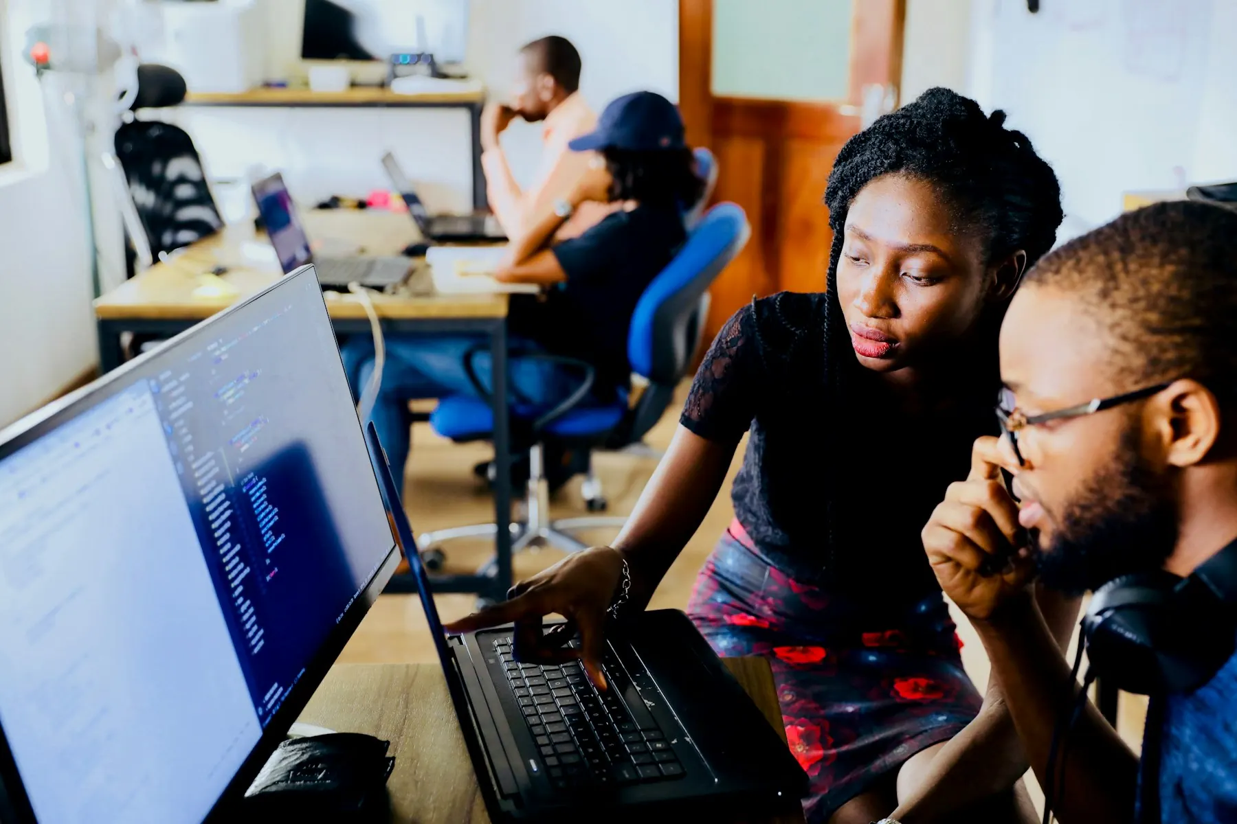 Team working late in front of screens